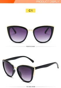 Gafas de sol de ojo de gato de moda para mujer con montura de metal y lentes degradadas.