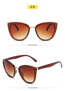 Gafas de sol ojo de gato mujer con montura de plástico y lentes degradadas vista detallada.