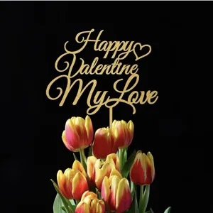 Glitter gold Happy Valentine My Love cake topper detail with fresh red yellow tulips background.