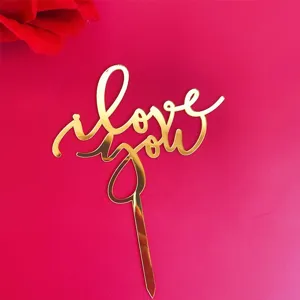 Gold acrylic I love you cake topper for Valentine's Day party dessert table decoration detail.