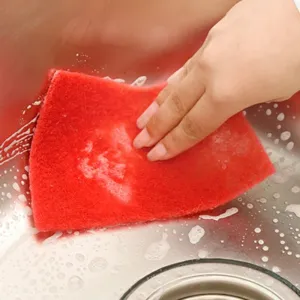 Red heavy-duty scouring pad sponge for kitchen dishwashing and cleaning, durable and efficient.