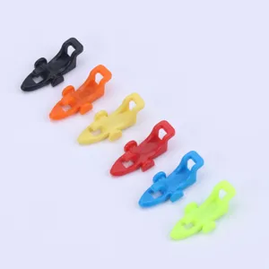 Detailed view of colorful plastic fishing hook keepers, ideal fishing rod tackle accessories.