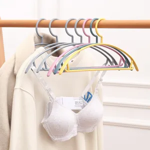 Durable plastic clothes hangers with wide shoulder non-slip design, perfect for home clothing storage.
