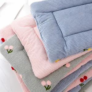 Cozy cloud fleece pet mat with reversible design, cute floral embroidery, soft dog bed.