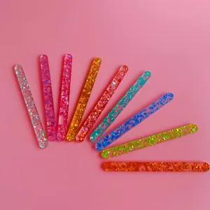 Close-up detail of colorful glitter acrylic DIY craft sticks, vibrant jelly colors for decoration.