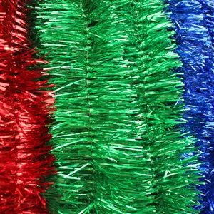 Close-up detail of colorful metallic tinsel garlands, perfect for holiday party decorations.