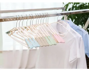 Adult non-slip plastic clothes hanger with colored soft rubber tips for home organization.