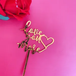 Gold acrylic Love You More cake topper, perfect for Valentines day party dessert decoration.