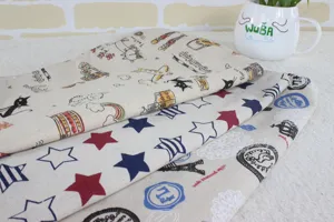 Detailed view of printed canvas fabric pet hammock and cat sleeping bag with various patterns.