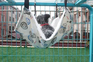 Cozy pet hanging hammock for cats and small dogs, comfortable plush interior, durable cage design.