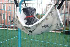 Pet hammock for cage, hanging cat bed with soft plush lining and cute cartoon cat print design.