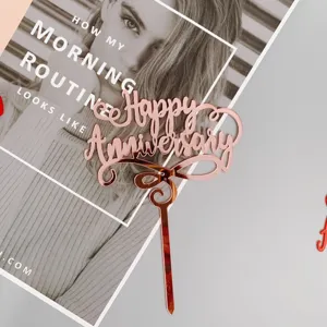 Rose gold acrylic Happy Anniversary cake topper for wedding celebration and party decor.