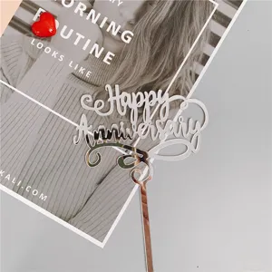 Silver acrylic Happy Anniversary cake topper for wedding celebration and romantic party decor.