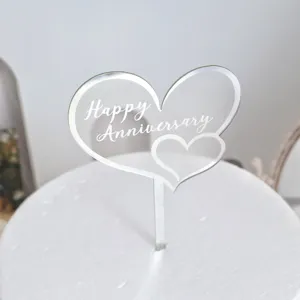 Acrylic heart cake topper engraved with Happy Anniversary for anniversary party celebration decor.