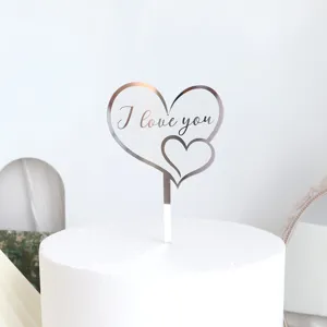 Silver reflective double heart acrylic cake topper with I love you text for romantic party decor.