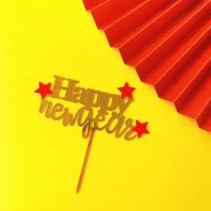 Acrylic Happy New Year cake topper gold mirror finish with red stars for party decoration.