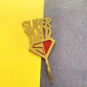 Gold acrylic Super Dad cake topper with red shield design for Father's Day party decoration.