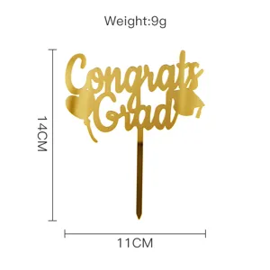 Gold acrylic graduation cake topper detail, featuring Congrats Grad text and cap design.