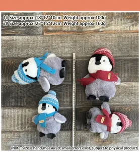 Cute plush penguin toy with knit hat and scarf, soft stuffed animal doll for kids gift.