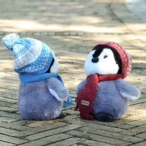 Cute penguin plush toy with knitted hat and scarf, soft stuffed doll for kids birthday gift.