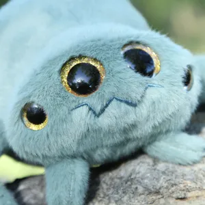 Close-up shot showing the detailed texture and glitter eyes of the cute plush spider toy.
