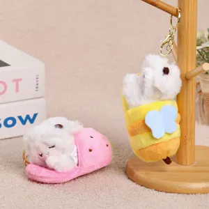 Cute plush sleeping sheep keychain featuring creative pull-out slipper design details.