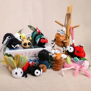 Close-up details of assorted cute plush insect keychains and bag hanging pendants set display.