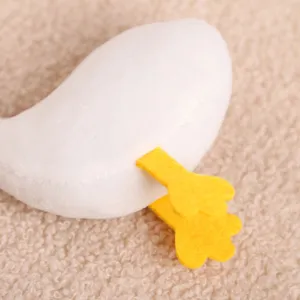 Cute plush toy white duck body part detail shot, soft fabric stuffed animal bag pendant accessory.