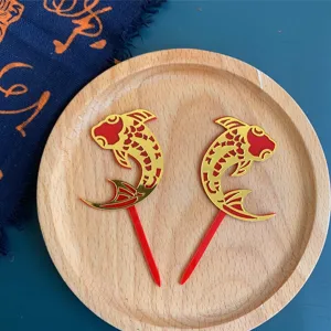 Exquisite red and gold acrylic koi fish cake topper for traditional Chinese party decoration.