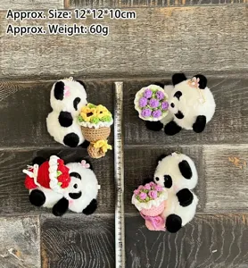 Detailed view of handmade crochet panda keychain holding cute flowers, soft plush pendant design.