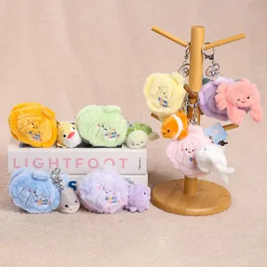 Ocean family shell plush keychain detail, cute marine creature surprise doll pendant toys.