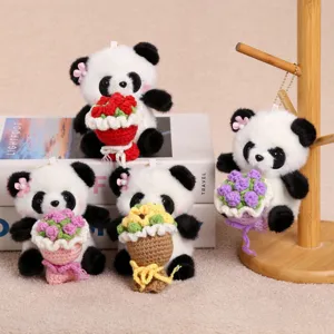 Close-up detail of cute crochet flower panda plush keychain with colorful bouquets.