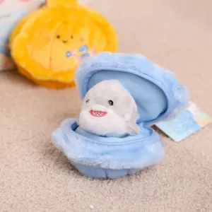 Cute plush seashell pendant with mini creature toy, soft ocean animal keychain for gifts.