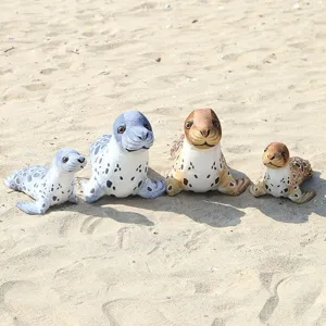 Detailed shot of cute realistic seal plush toys set, soft stuffed marine animal figures for kids.