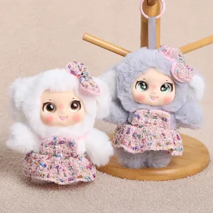 Cute plush doll keychain with vinyl face and tweed dress, perfect bag charm and toy gift.