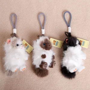 Detailed view of fluffy long-haired cat plush keychains, showcasing cute plush texture and design.