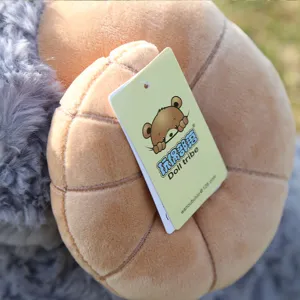 Close-up detail of bighorn sheep plush toy horn with brand tag, soft and fluffy stuffing.