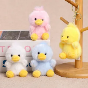 Cute four-color plush duck keychains, soft stuffed animal doll pendants for bags or keys.