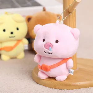Cute pink pig plush pendant with tear design, soft keychain accessory for school bags.