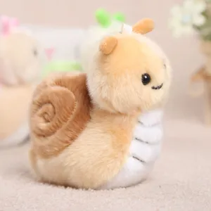 Close-up detail view of a cute plush snail keychain, soft fluffy fabric and lovely design.
