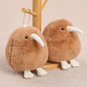 Close up view of cute kiwi bird plush keychain, soft brown stuffed toy pendant for bags.