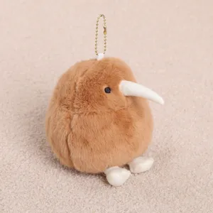 Cute kiwi bird plush toy pendant close-up, soft brown fluff fabric with metal chain.