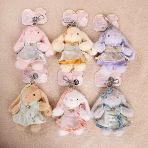 Detailed view of Chinese style Wendy bunny plush keychains showcasing exquisite dresses.