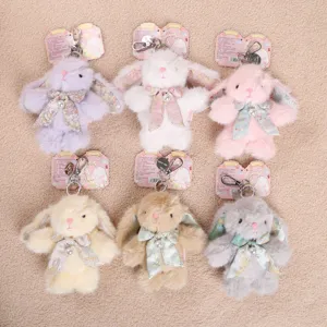 Detailed view of cute New Chinese style bunny plush toy keychains with floral bows and pearls.