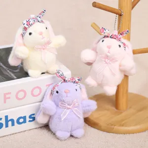 Llavero de conejito de peluche lindo con diadema floral y lazo, colgante de juguete suave.