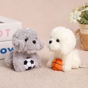 Cute sitting teddy dog plush pendant toy holding balls, soft puppy doll for girls birthday gift.