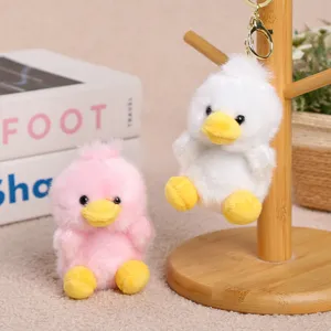 Cute plush duck keychain detail, soft stuffed animal doll pendant for girls and bags.