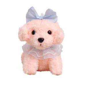 Cute pink sitting teddy dog plush toy pendant with blue bow and lace collar, soft gift.