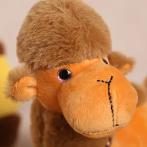 Cute plush camel toy detail shot, soft brown fabric, exquisite stitching, lovely bag pendant.