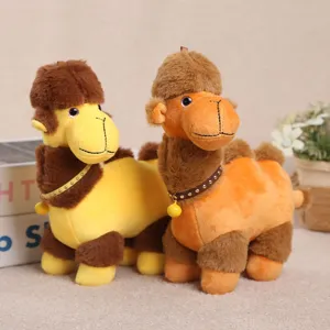 Close-up of cute plush camel toys with little bells, perfect for cute bag charms and cozy decor.